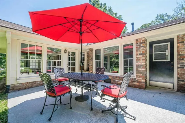 a aerial view of a house with yard and green space
