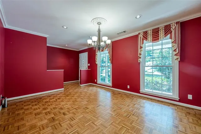 a kitchen with stainless steel appliances granite countertop a sink and dishwasher a stove top oven with white cabinets