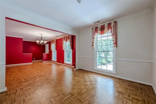 a kitchen with granite countertop white cabinets stainless steel appliances and a sink