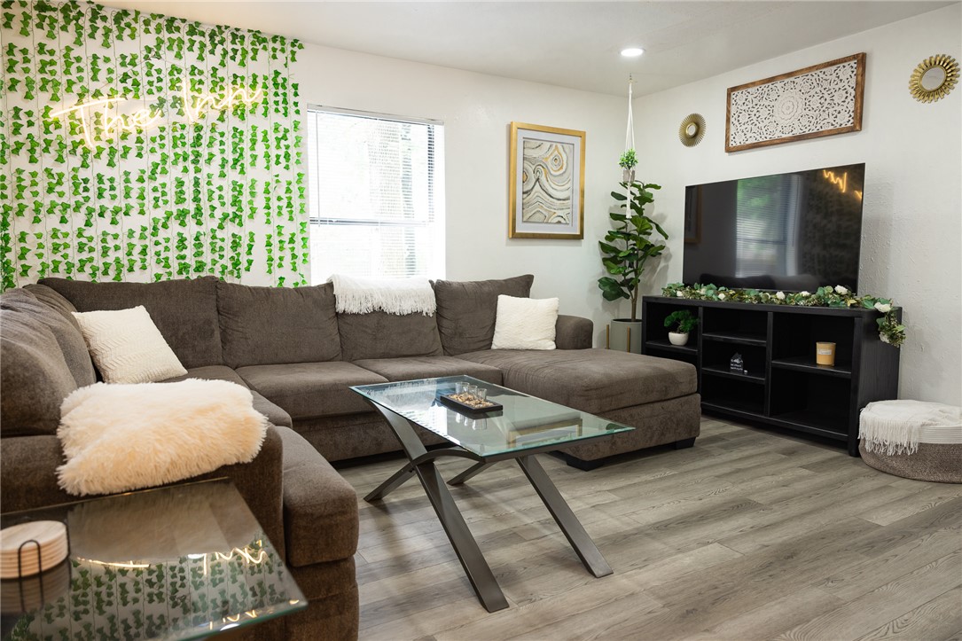 800 Navidad Street Bryan, TX 77801 - Photo 21 of 42 Living room featuring light wood finished floors and recessed lighting