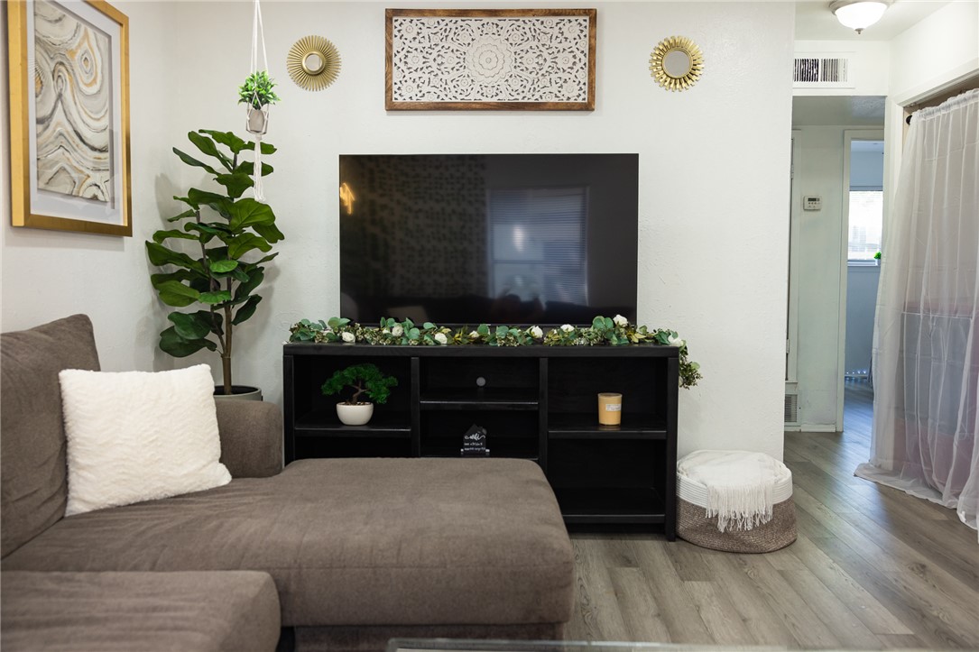800 Navidad Street Bryan, TX 77801 - Photo 22 of 42 Living area with wood finished floors and baseboards