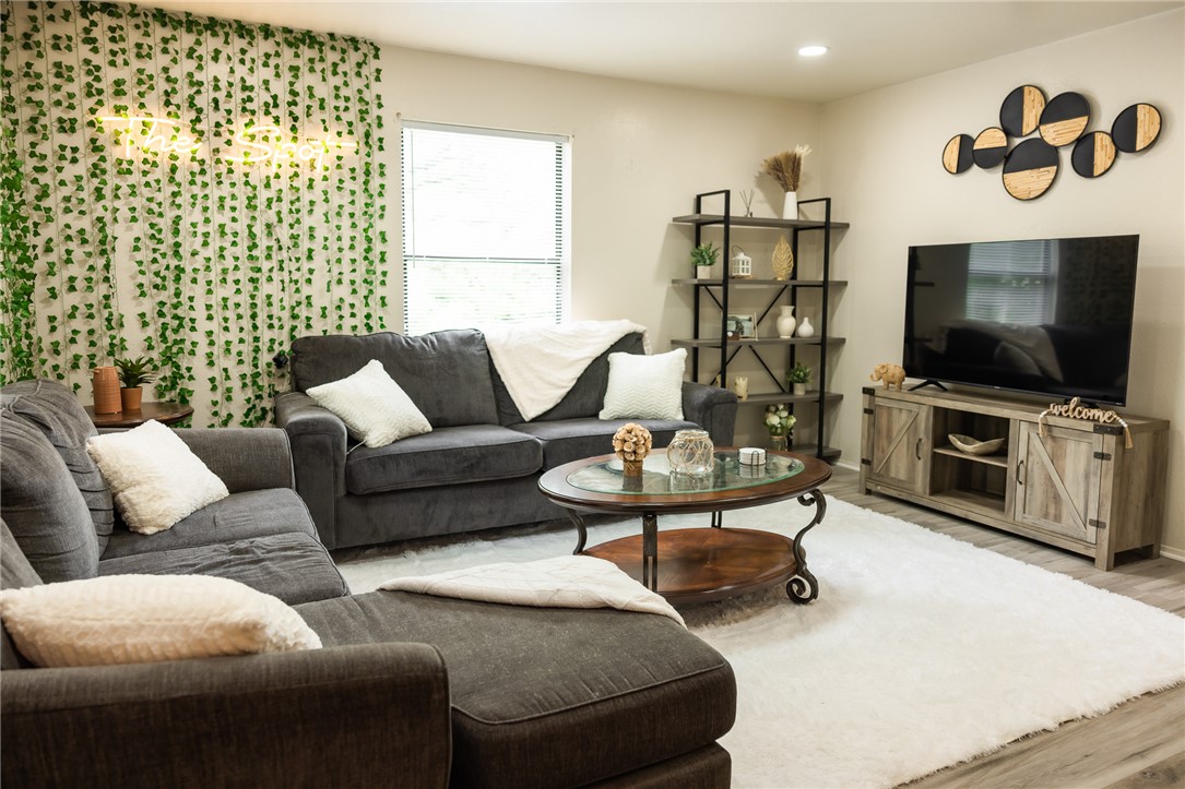 800 Navidad Street Bryan, TX 77801 - Photo 24 of 42 Living area with light wood finished floors and recessed lighting