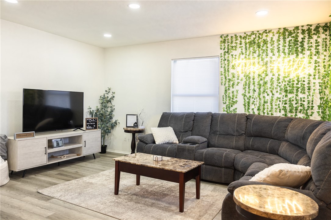 800 Navidad Street Bryan, TX 77801 - Photo 30 of 42 Living room with light wood-style floors and recessed lighting