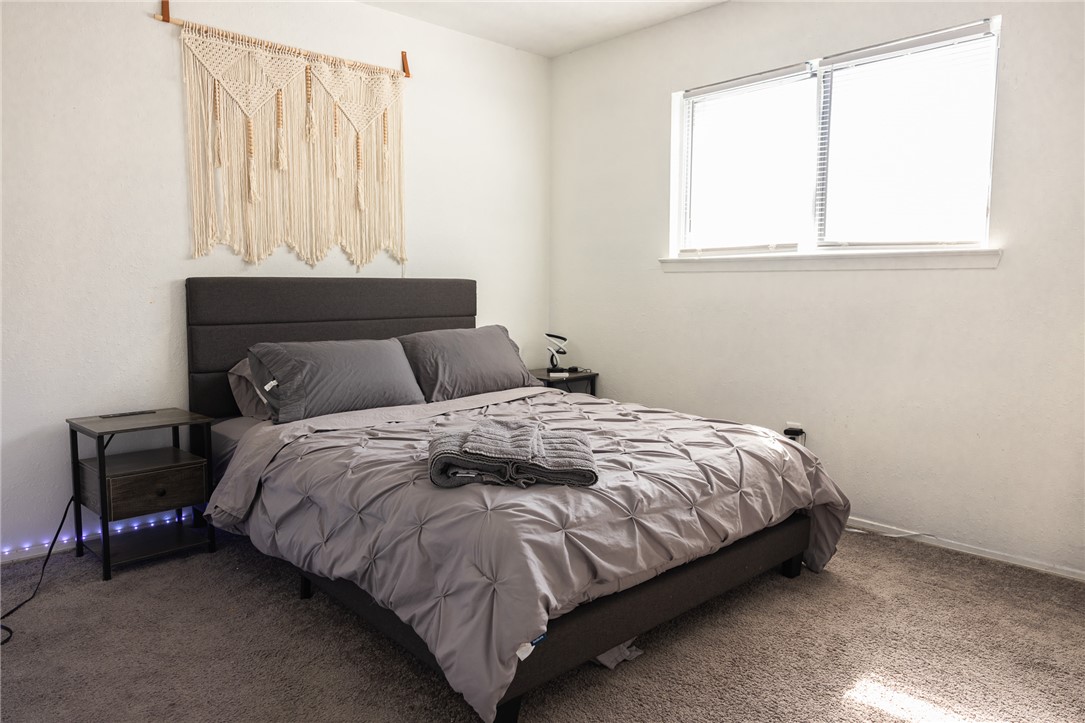 800 Navidad Street Bryan, TX 77801 - Photo 31 of 42 Carpeted bedroom featuring baseboards