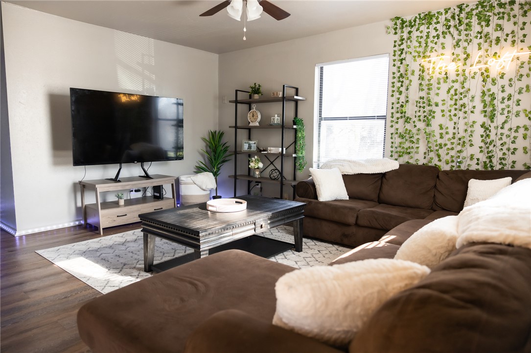 800 Navidad Street Bryan, TX 77801 - Photo 33 of 42 Living room featuring a ceiling fan and wood finished floors