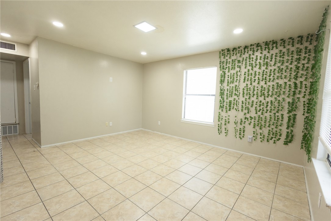 800 Navidad Street Bryan, TX 77801 - Photo 42 of 42 Empty room with recessed lighting and light tile patterned floors
