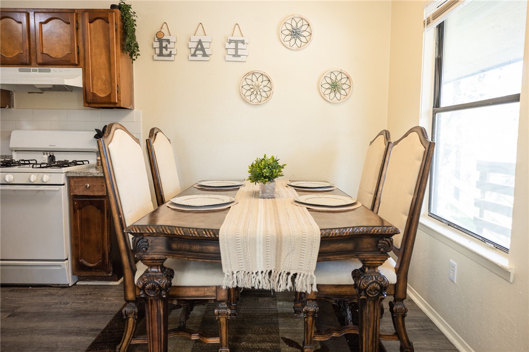 800 Navidad Street Bryan, TX 77801 - Photo 6 of 42 Dining area with plenty of natural light and dark wood finished floors