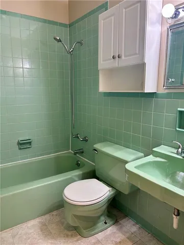 a bathroom with a sink toilet and bathtub