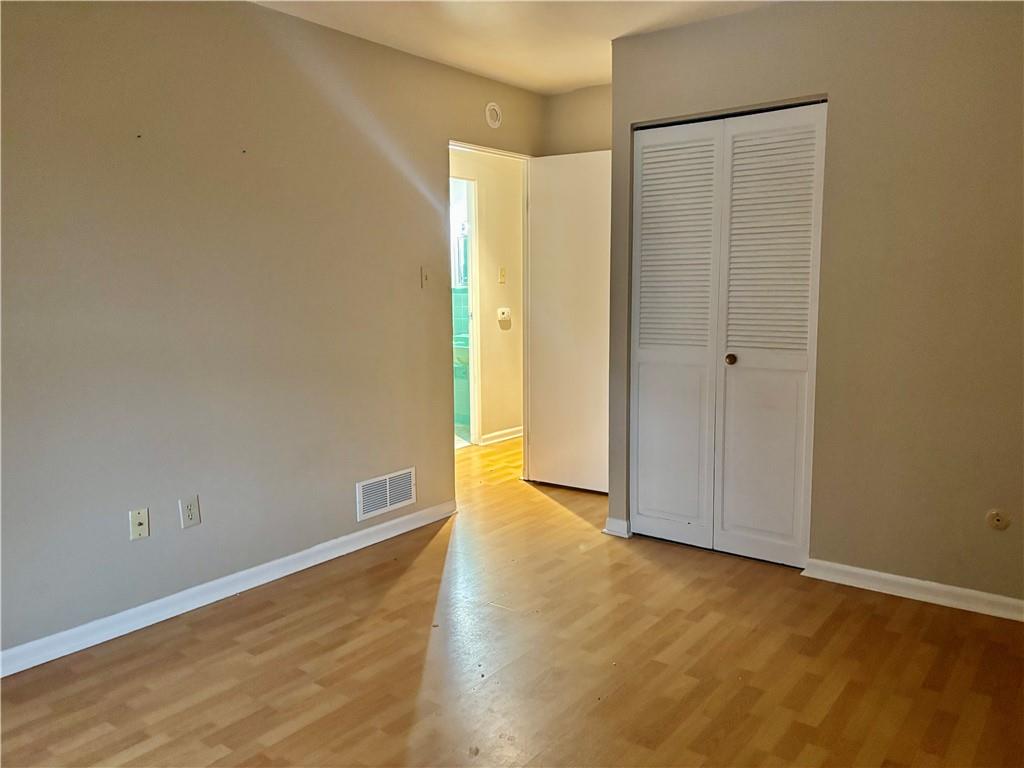 105 Pittsburgh Street, Unit 2C Uniontown, PA 15401 - Photo 18 of 21 a view of an empty room with wooden floor