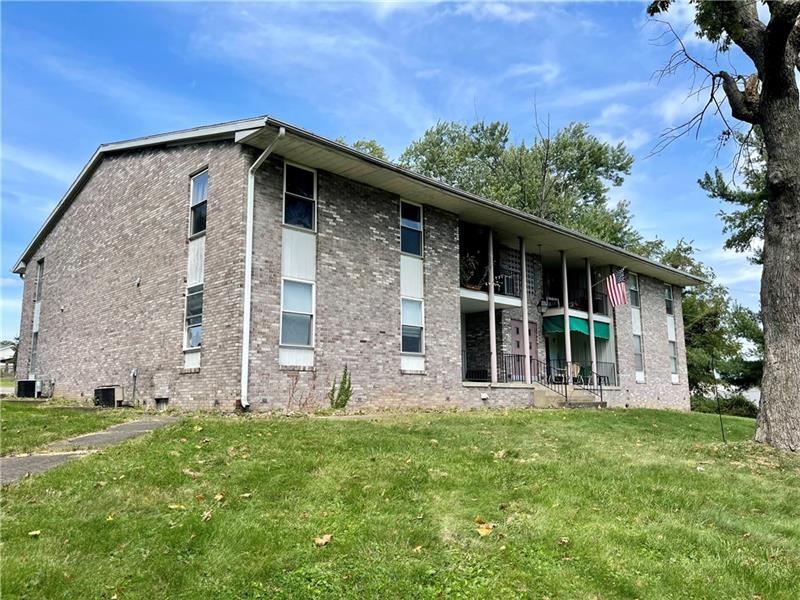 105 Pittsburgh Street, Unit 2C Uniontown, PA 15401 - Photo 2 of 21 a front view of a house with garden