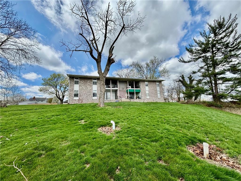 105 Pittsburgh Street, Unit 2C Uniontown, PA 15401 - Photo 3 of 21 a view of a big yard with large trees