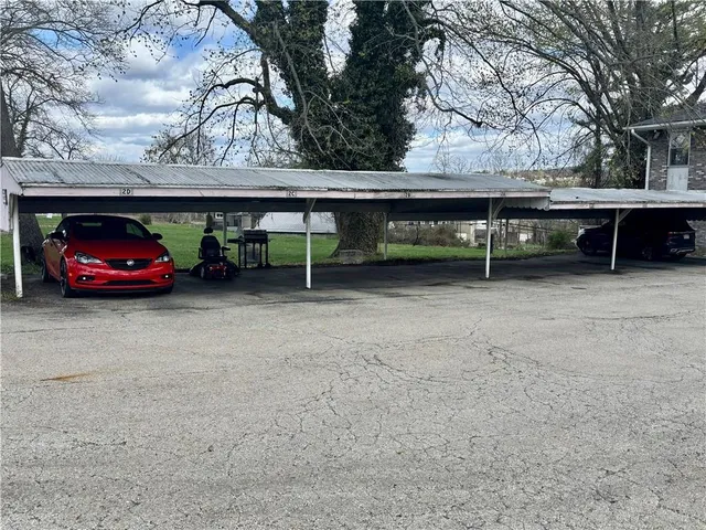 a view of backyard with a table and chairs