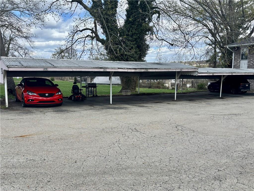 105 Pittsburgh Street, Unit 2C Uniontown, PA 15401 - Photo 6 of 21 a view of backyard with a table and chairs