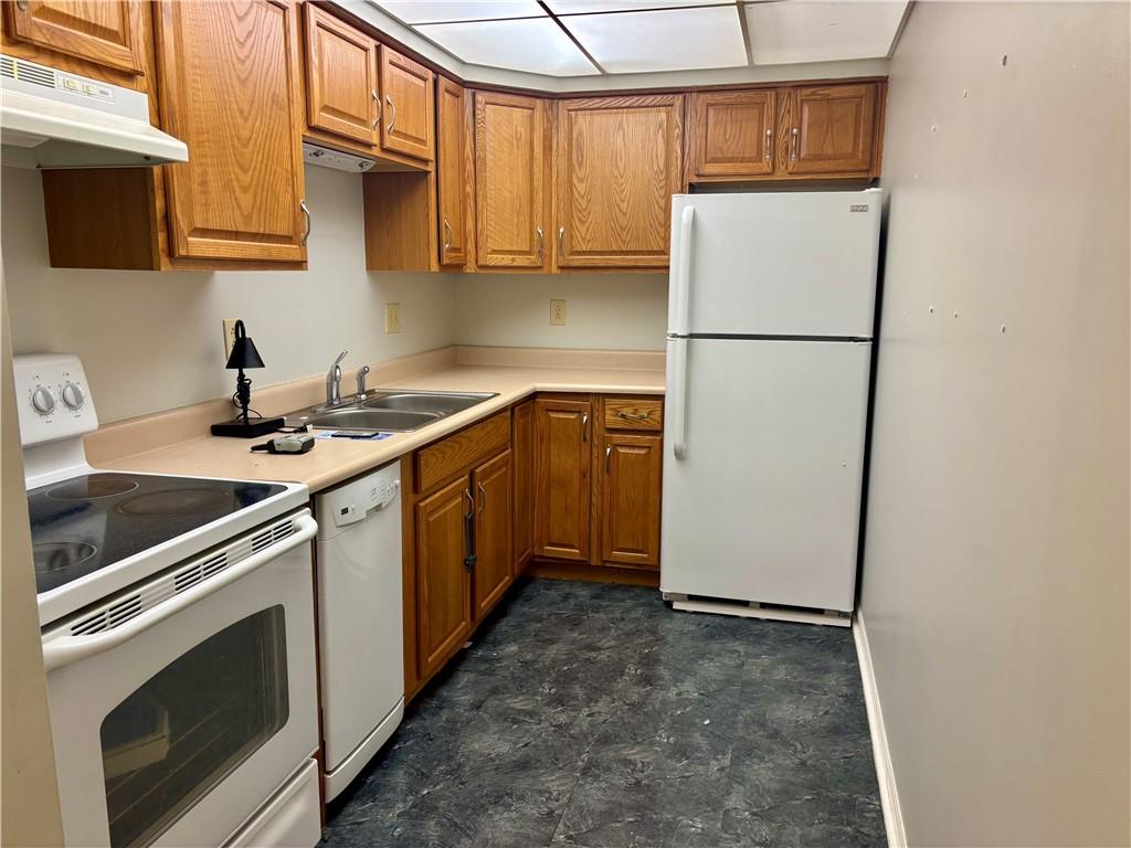 105 Pittsburgh Street, Unit 2C Uniontown, PA 15401 - Photo 8 of 21 a kitchen with a sink a refrigerator and a stove