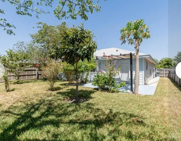 a backyard of a house with lots of green space