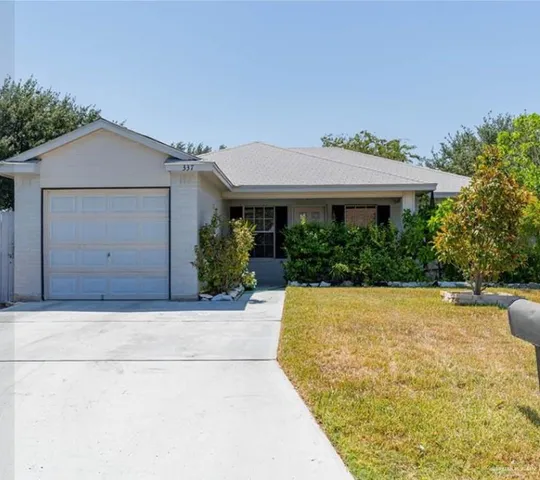 a house view with a garden space