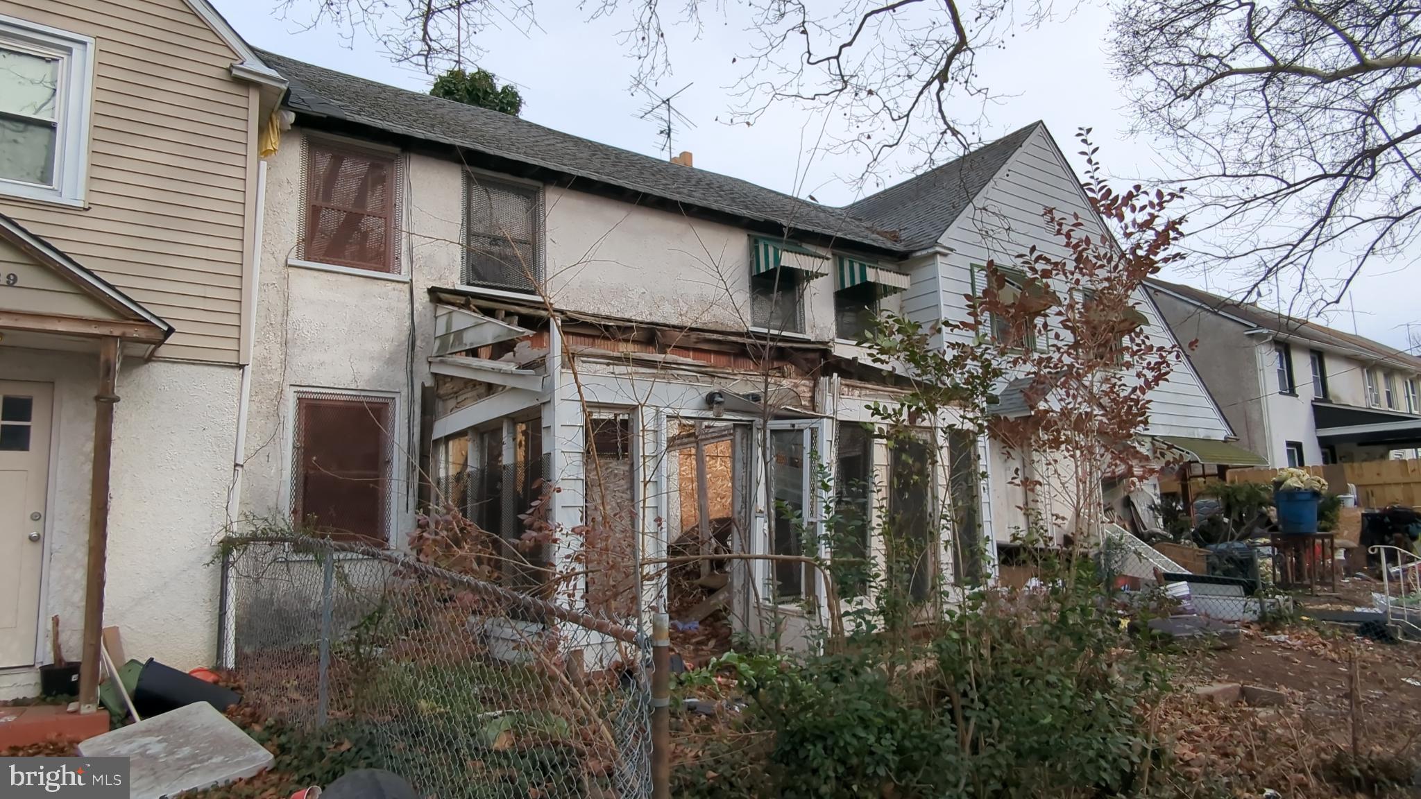 a view of a house with a tree