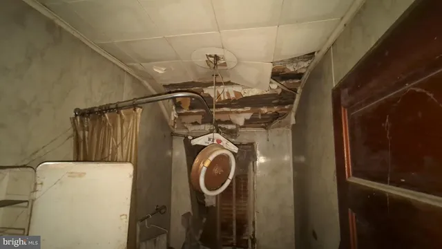 a view of storage and utility room with washer and dryer