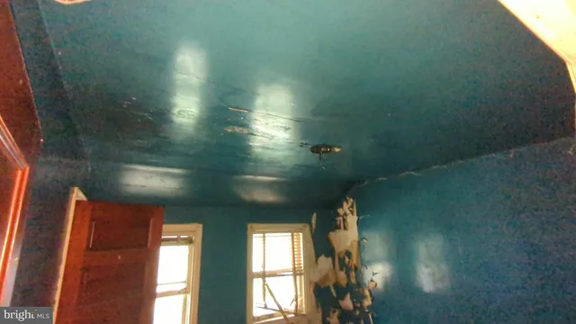 a view of entryway and hall with a window