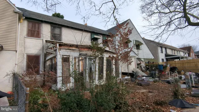 a view of a house with a tree