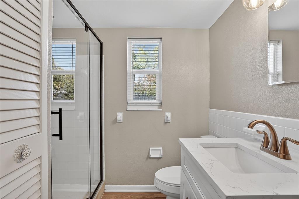 8244 125th Street Seminole, FL 33776 - Photo 12 of 32 a bathroom with a sink toilet and shower