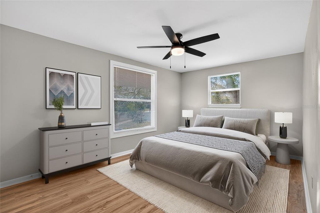 8244 125th Street Seminole, FL 33776 - Photo 13 of 32 a spacious bedroom with a bed and a window