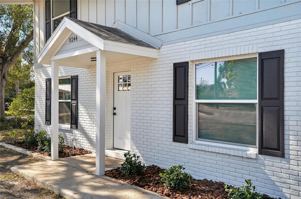 8244 125th Street Seminole, FL 33776 - Photo 2 of 32 a front view of a house with a yard