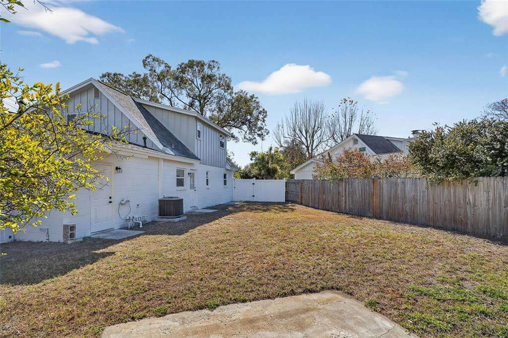 8244 125th Street Seminole, FL 33776 - Photo 22 of 32 a view of a house with a yard
