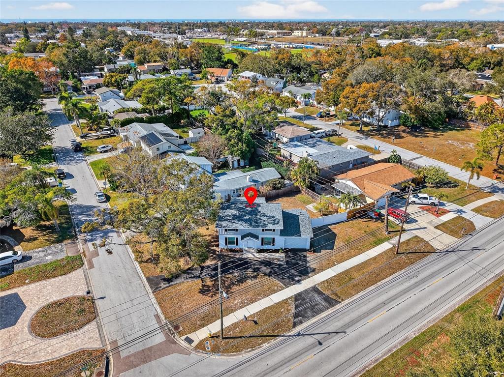 8244 125th Street Seminole, FL 33776 - Photo 25 of 32 an aerial view of residential houses with outdoor space