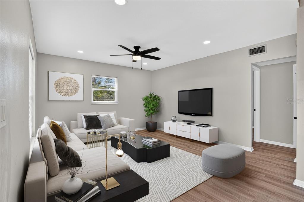 8244 125th Street Seminole, FL 33776 - Photo 3 of 32 a living room with furniture and a flat screen tv