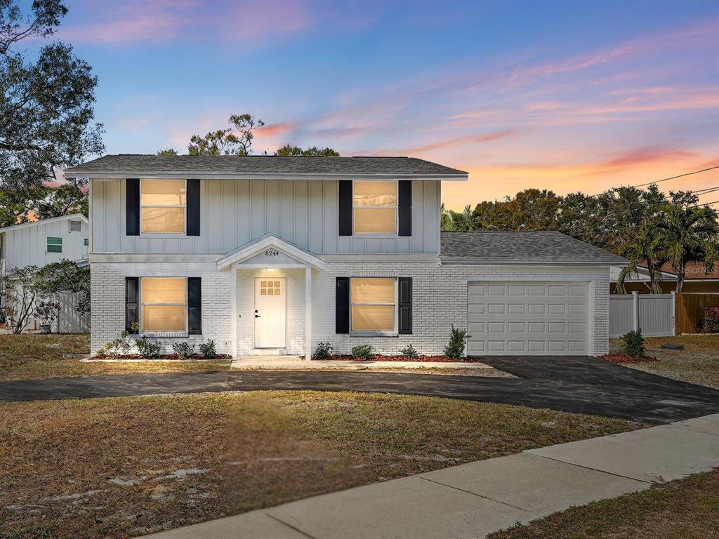 8244 125th Street Seminole, FL 33776 - Photo 32 of 32 a front view of a house with a yard