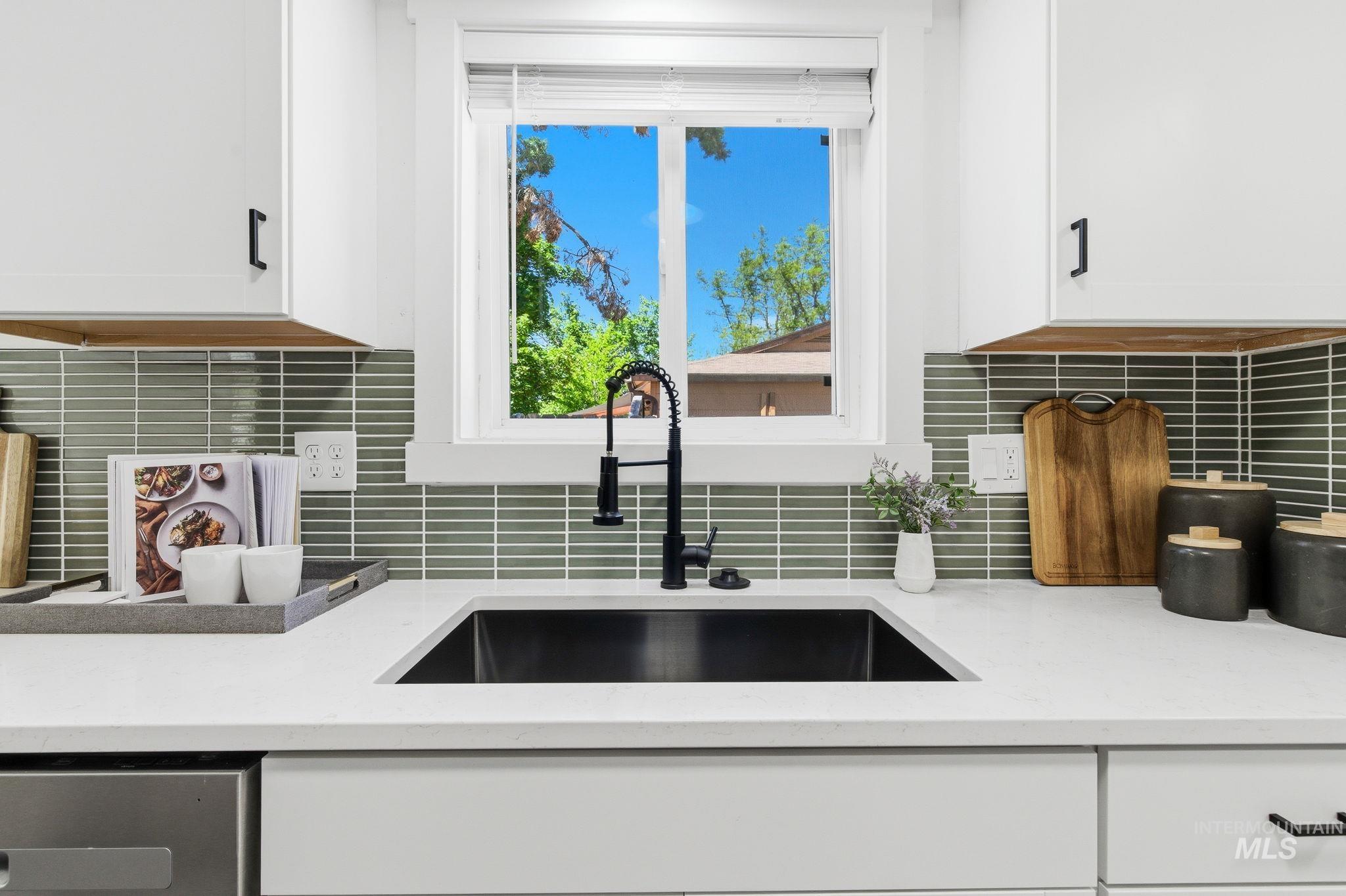 2224 Rachel Circle Boise, ID 83706 - Photo 19 of 50 Kitchen sink area featuring a black basin, a matte black pull-down faucet, and white countertops