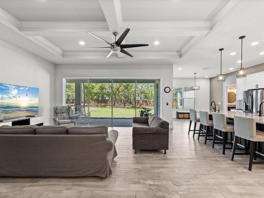 11981 Robina Road Weeki Wachee, FL 34614 - Photo 5 of 93 a living room with furniture and a large window