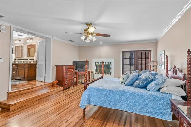 a bedroom with furniture and a wooden floor