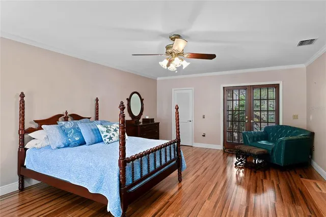 a bathroom with a granite countertop sink a mirror and shower