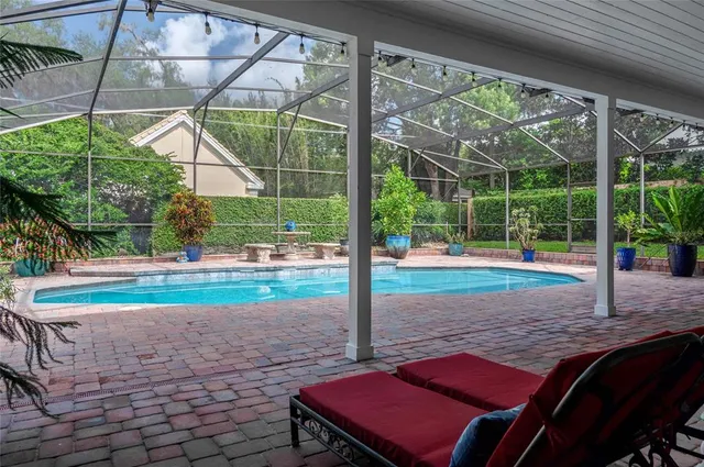 a view of a house with backyard porch and sitting area