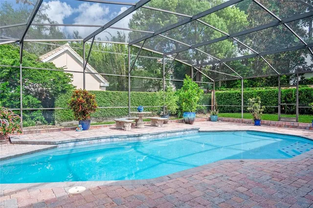 a view of a swimming pool with a patio