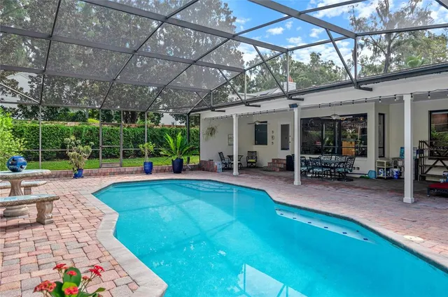 an aerial view of a house with a garden and yard