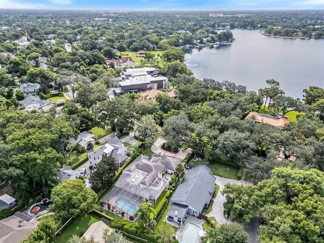 an aerial view of a city with lake view