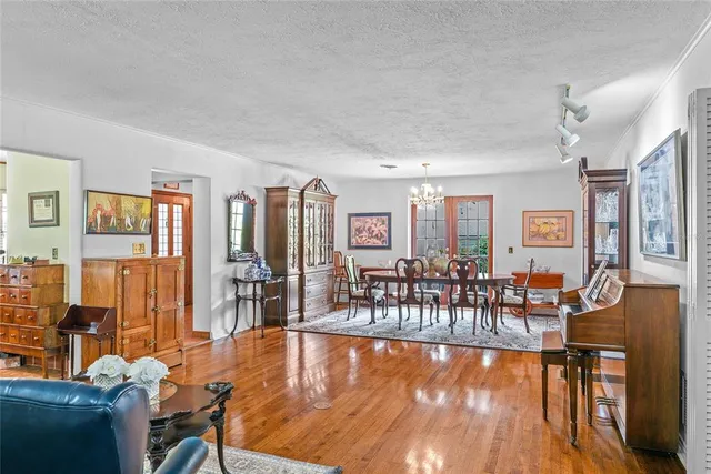 a living room with lots of furniture and wooden floor
