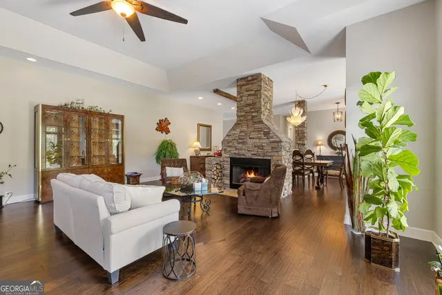 a kitchen with stainless steel appliances kitchen island granite countertop a sink and cabinets