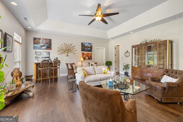 a kitchen with stainless steel appliances granite countertop a sink refrigerator and cabinets