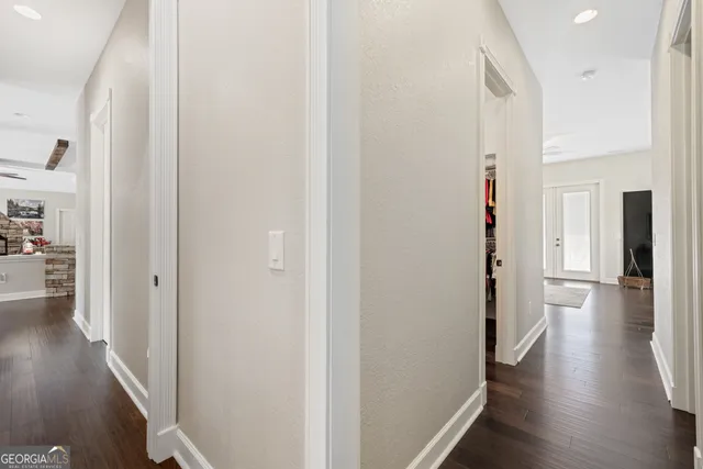 a view of a livingroom with furniture and a flat screen tv