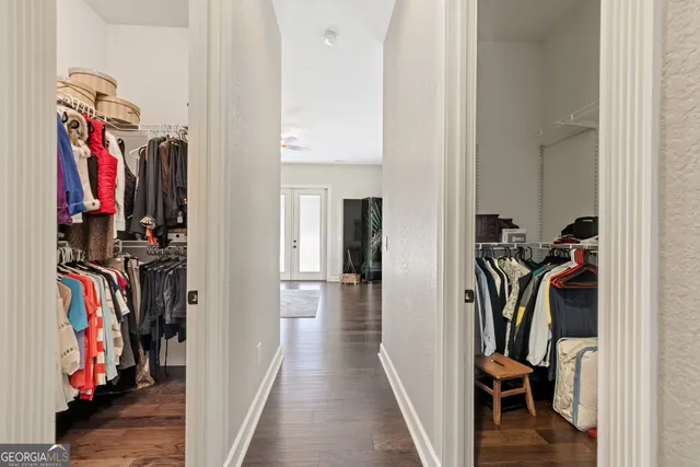 a bedroom with a bed and a tv