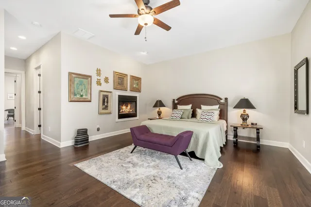 a bathroom with a sink vanity mirror and toilet