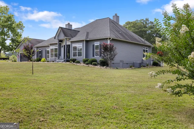 a front view of a house with yard