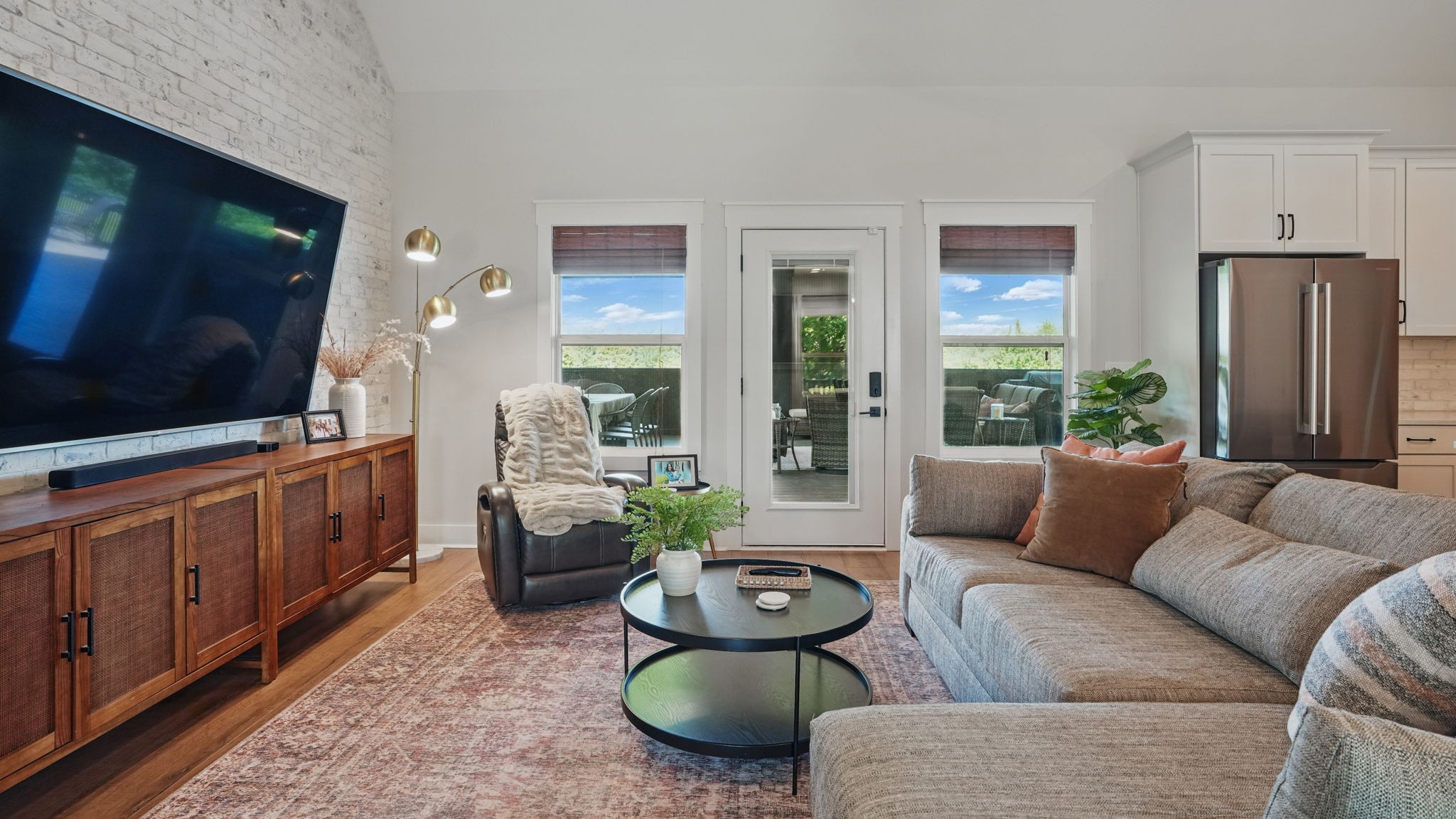 211 Claypool Road Bethpage, TN 37022 - Photo 6 of 73 a living room with furniture a flat screen tv and a view of kitchen