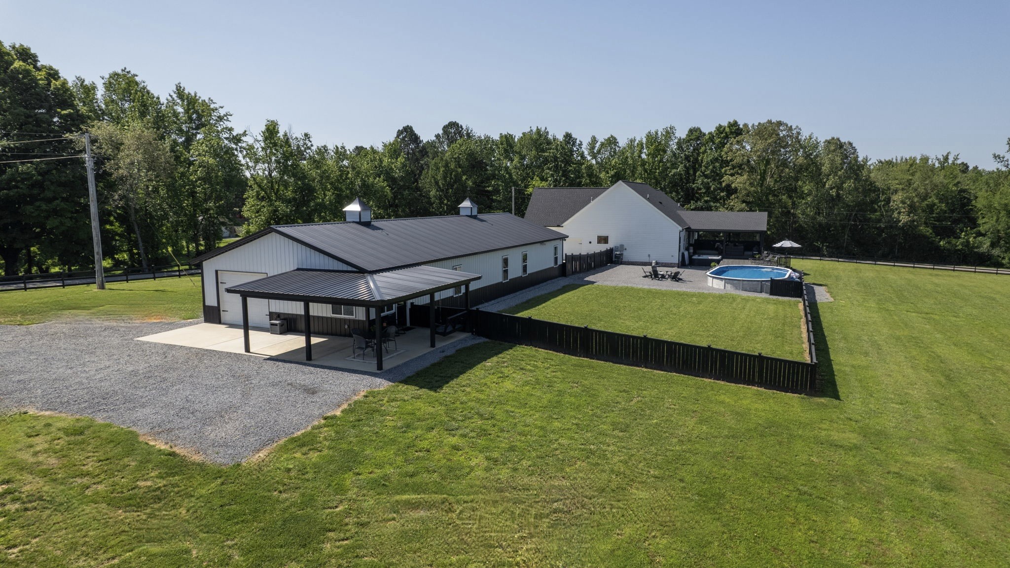 211 Claypool Road Bethpage, TN 37022 - Photo 72 of 73 a aerial view of a house with swimming pool and yard