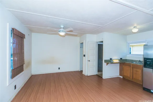 a view of a kitchen with a sink dishwasher and a refrigerator