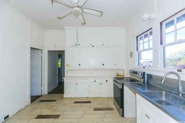 a view of cabinets a sink and dishwasher in a kitchen